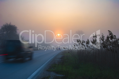 blurred car, early morning sunrise