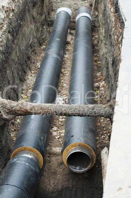 installing pipes for hot water and steam heating