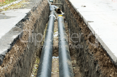 installing pipes for hot water and steam heating
