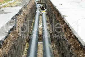 installing pipes for hot water and steam heating