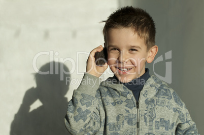 child talking by mobile phone