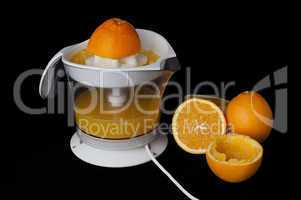 citrus juicer and oranges