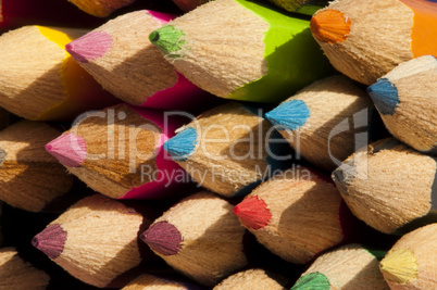 Multicolored pencils arranged background