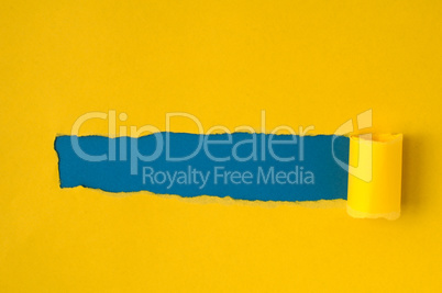 Yellow torn paper with blue space for text