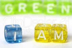 Text I am green on colorful cubes