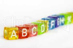 Text A B C on colorful wooden cubes