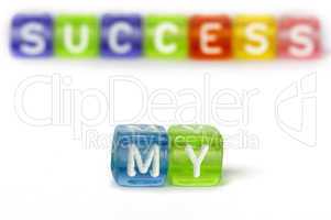 Text My success on colorful wooden cubes