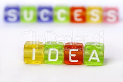 Text Idea and success on colorful wooden cubes