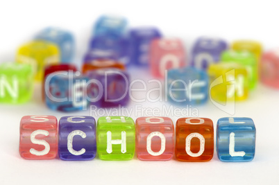 Text construction on colorful wooden cubes over white
