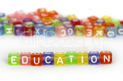 Text Education on colorful wooden cubes