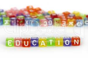 Text Education on colorful wooden cubes