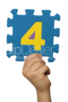 Children hand holding the number Four. White isolated number