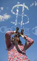 Woman watching with binoculars