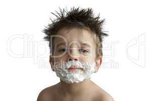 A little boy shaving