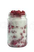Jar with sugar and wild raspberries