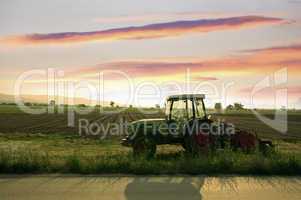 Plowed land and tractor