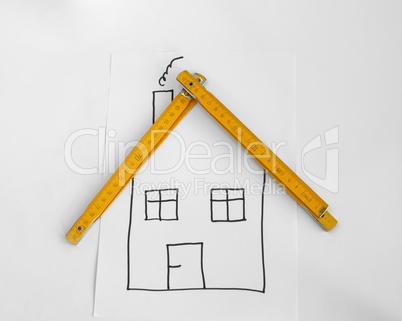 Drawed house and wooden meter