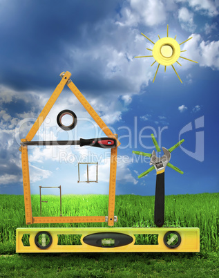 House with tree and sun made of tools for building.White isolate