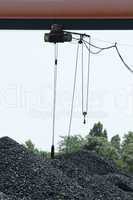 Crane and piles of coal