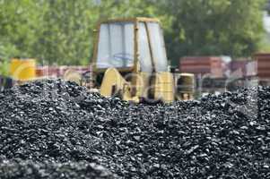 Excavator and coal piles