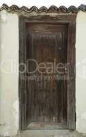 Old brown wooden vertical door