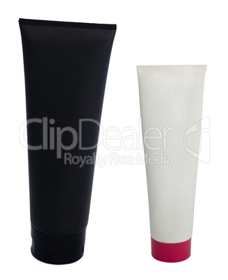 Black and white cosmetic tubes