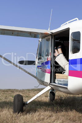 Female legs in a helicopter