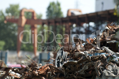 Pile of scrap iron and crane