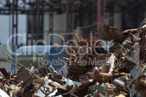 Pile of scrap iron and crane