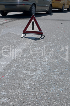 Broken glass from car on a road.