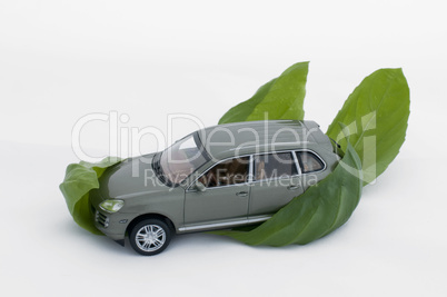 Green leaves and a car.Ecology conception