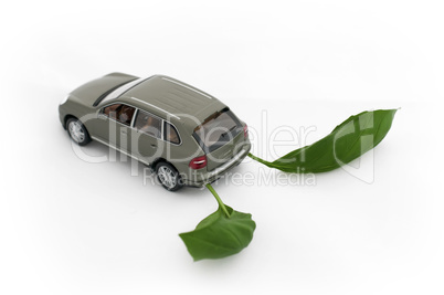 Green leaves and a car.Ecology conception