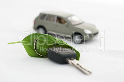Key, green leave and a car.Ecology conception
