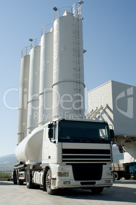 Cement factory with silos and mixer truck