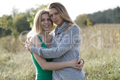 two loving sisters comforting each other