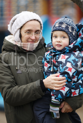 woman holding her small son