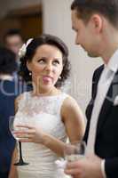 bride and groom enjoy a drink at the wedding
