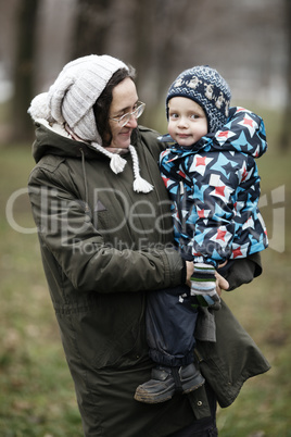 woman holding her small son