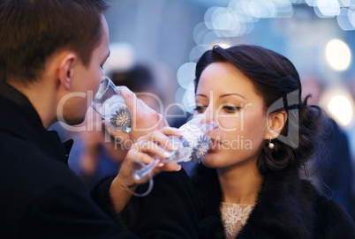 couple toasting each other with champagne