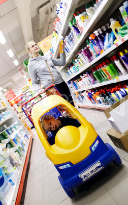 mother and son shopping in a supermarket