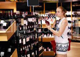 woman shopping for alcohol in a bottle store