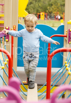 cute little boy playing in a playground