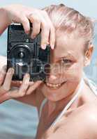 woman laughing as she views a photo