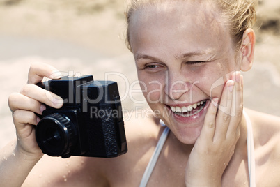 woman laughing as she views a photo