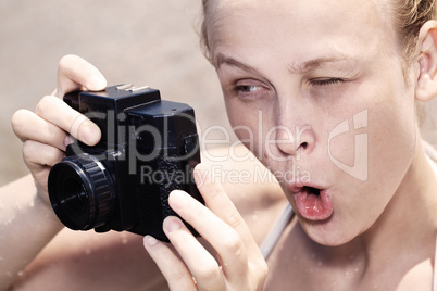 woman pulling a comical face as she views in the viewfinder