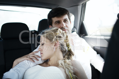 woman sleeping on her husbands shoulder