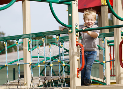 boy on playground equipment.