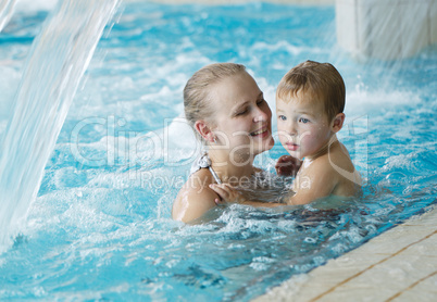 mother and her son in the swimming pool.