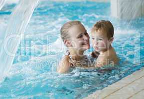 mother and her son in the swimming pool.