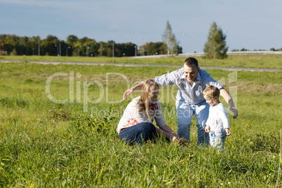 protective father playing with his wife and son